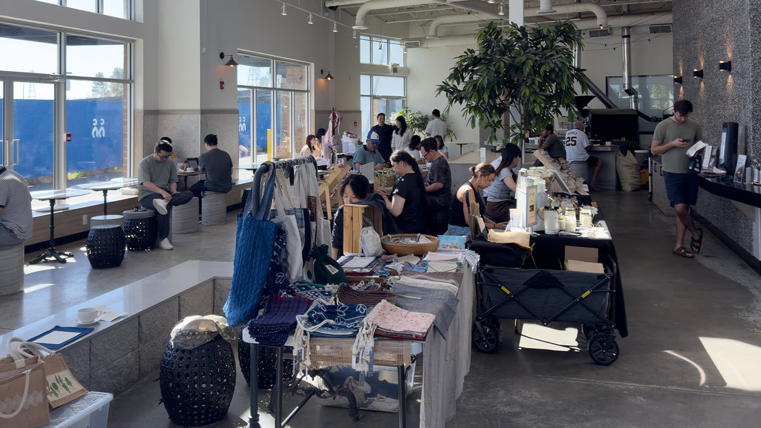 Crowded market scene with vendors and customers engaging in a lively atmosphere at the C Market Coffee Pop-Up Market.