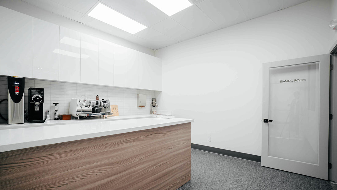 Clean and professional training room at C Market Coffee, equipped with coffee-making tools and a modern, minimalist setup for coffee classes.